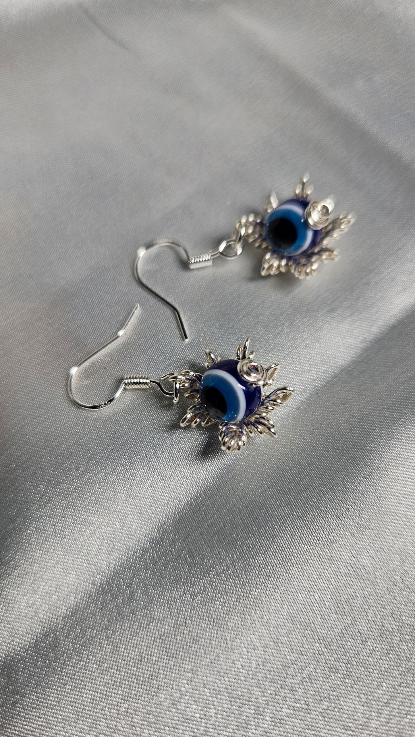 Evil eye silver star earrings